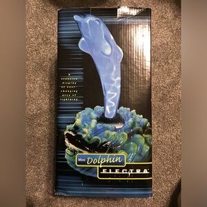 Mini Dolphin Electra. Electric hand blown glass dolphin in glass stand